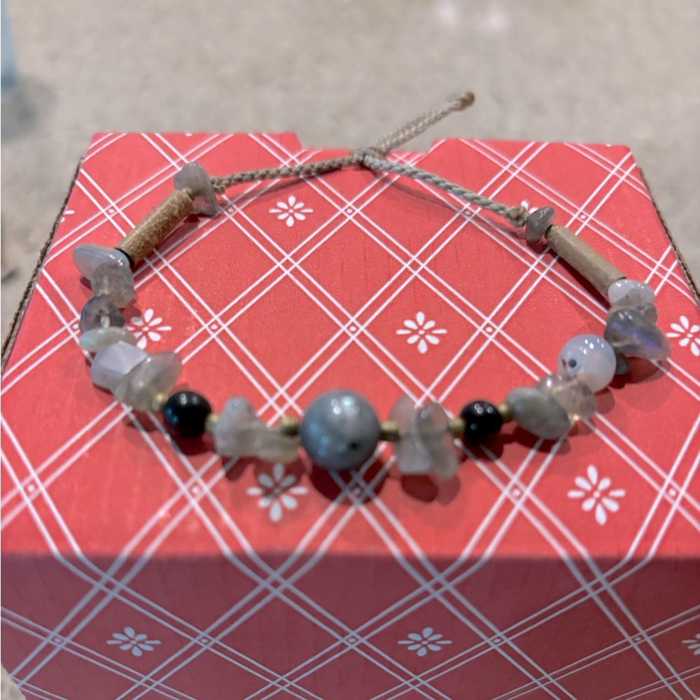 Stone cord bracelet.